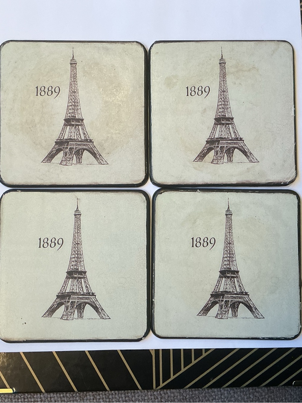 Set of Four Coasters in a very nice wooden box.